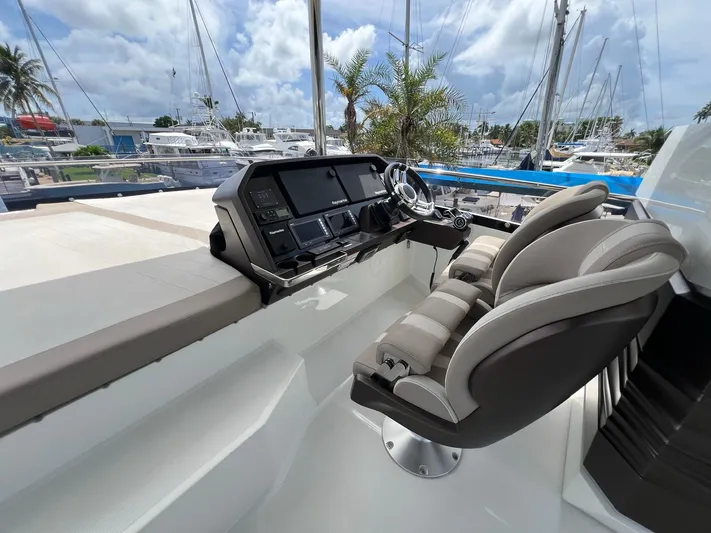 Yacht Photos Pics Helm of 2020 Galeon 680 Fly yacht with modern controls and plush seating.