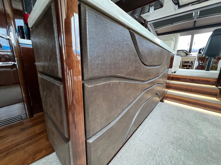  Yacht Photos Pics Luxurious interior of 2020 Galeon 680 Fly yacht with elegant wood and leather finishes.