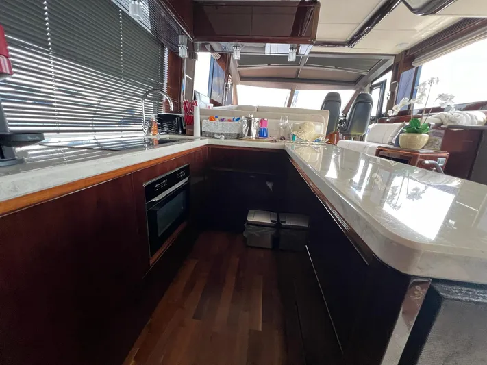  Yacht Photos Pics Luxurious kitchen interior of 2020 Galeon 680 Fly yacht with modern amenities.