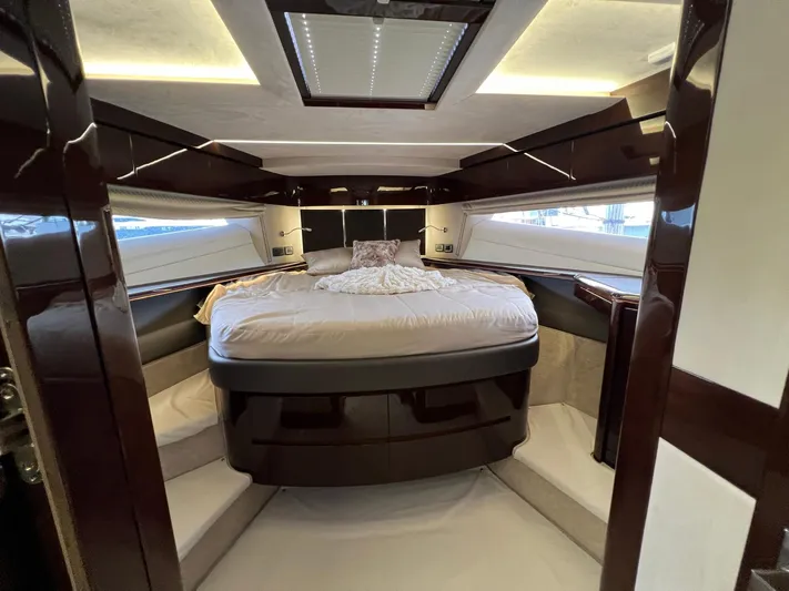  Yacht Photos Pics Luxurious bedroom interior of 2020 Galeon 680 Fly yacht with modern design and ambient lighting.
