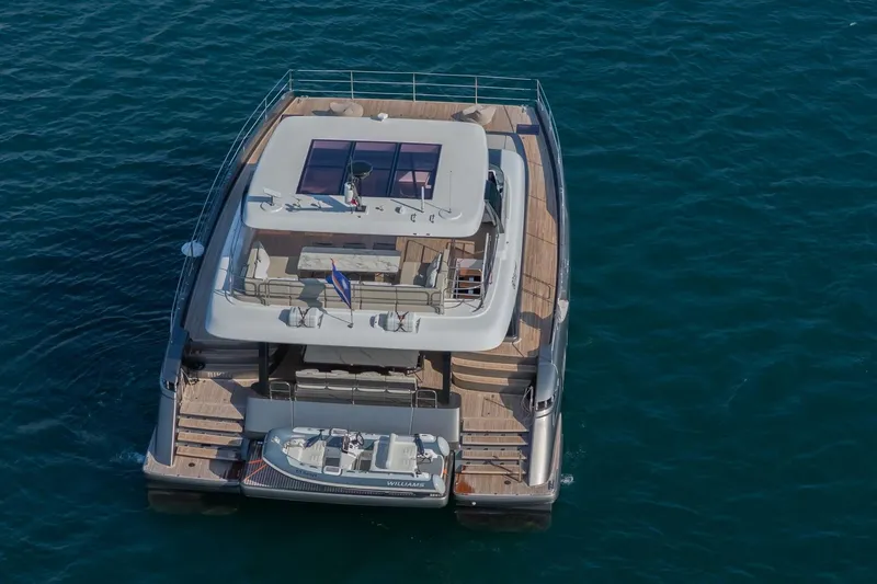  Yacht Photos Pics Luxury Sunreef 60 Power yacht, 2023 model, cruising on open water.