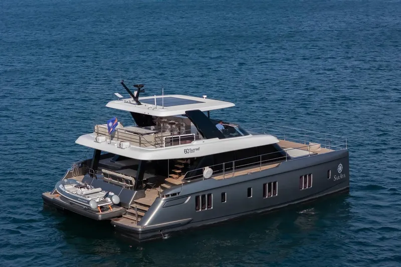  Yacht Photos Pics Luxurious 2023 Sunreef 60 Power yacht cruising on open sea.