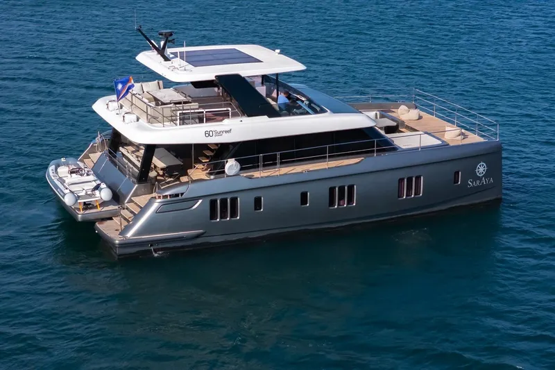  Yacht Photos Pics Luxury Sunreef 60 Power yacht, 2023 model, cruising on serene blue waters.