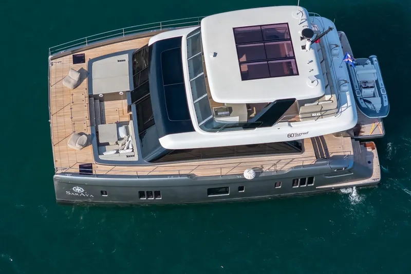  Yacht Photos Pics Aerial view of 2023 Sunreef 60 Power yacht on the water.