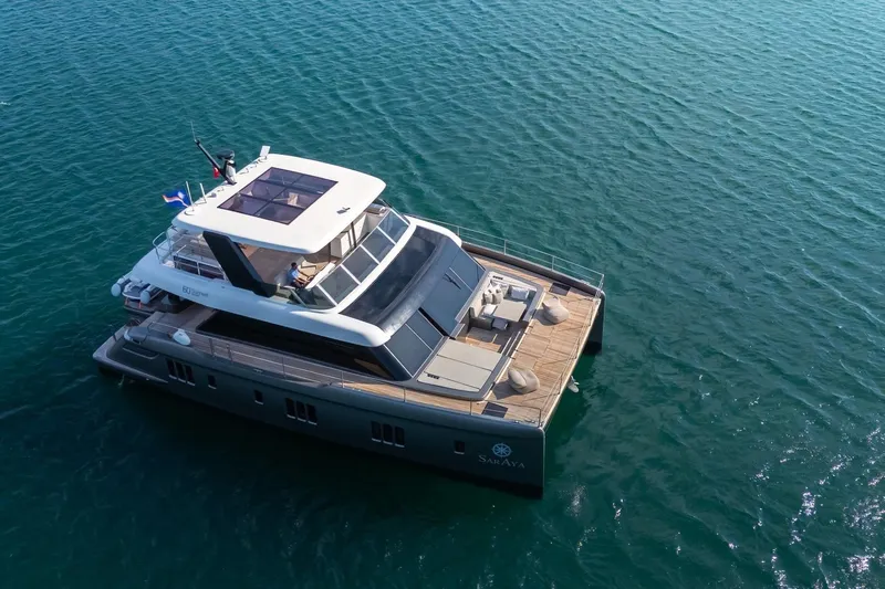  Yacht Photos Pics 2023 Sunreef 60 Power yacht on open water, aerial view.