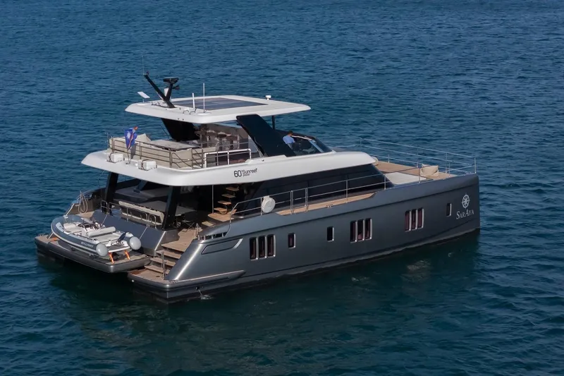  Yacht Photos Pics Luxurious 2023 Sunreef 60 Power yacht cruising on open water.