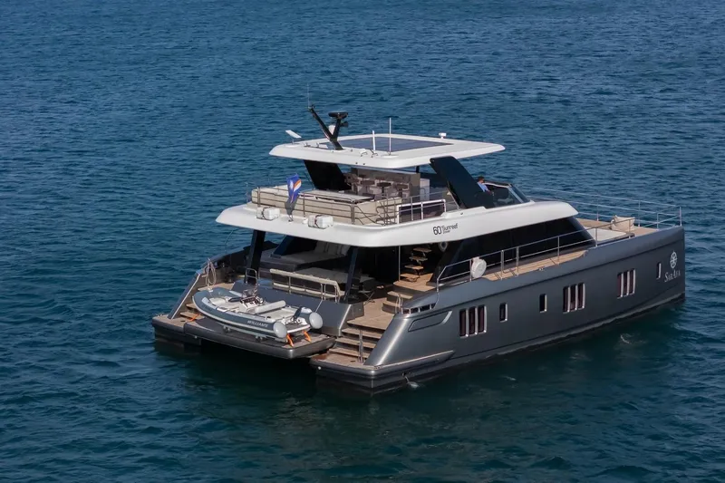  Yacht Photos Pics Luxury Sunreef 60 Power yacht, 2023 model, cruising on open water.