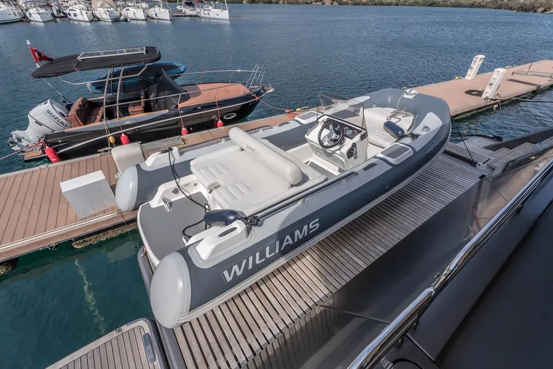  Yacht Photos Pics 2023 Sunreef 60 Power yacht with Williams tender docked at marina.