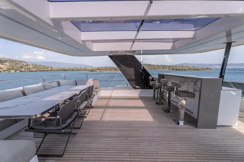  Yacht Photos Pics Luxurious Sunreef 60 Power yacht deck with seating and bar, 2023 model.