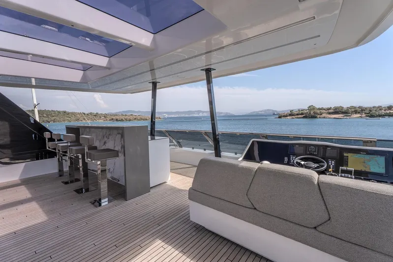  Yacht Photos Pics Luxurious Sunreef 60 Power yacht interior, featuring modern bar and navigation area, 2023 model.