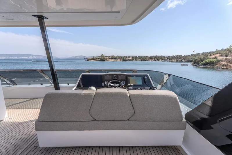  Yacht Photos Pics Luxurious Sunreef 60 Power yacht helm with scenic ocean view, 2023 model.