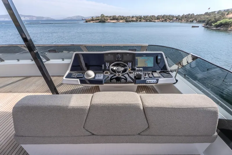  Yacht Photos Pics Helm station of 2023 Sunreef 60 Power yacht overlooking serene waters.