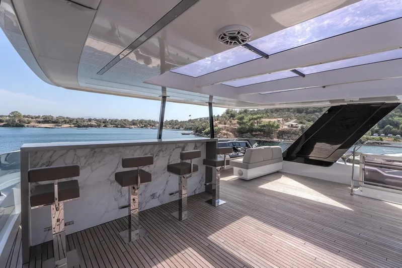  Yacht Photos Pics Luxurious Sunreef 60 Power yacht interior with bar stools and scenic ocean view, 2023 model.