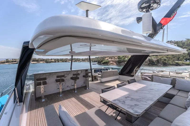  Yacht Photos Pics Luxurious Sunreef 60 Power yacht deck with elegant seating and scenic ocean view, 2023 model.