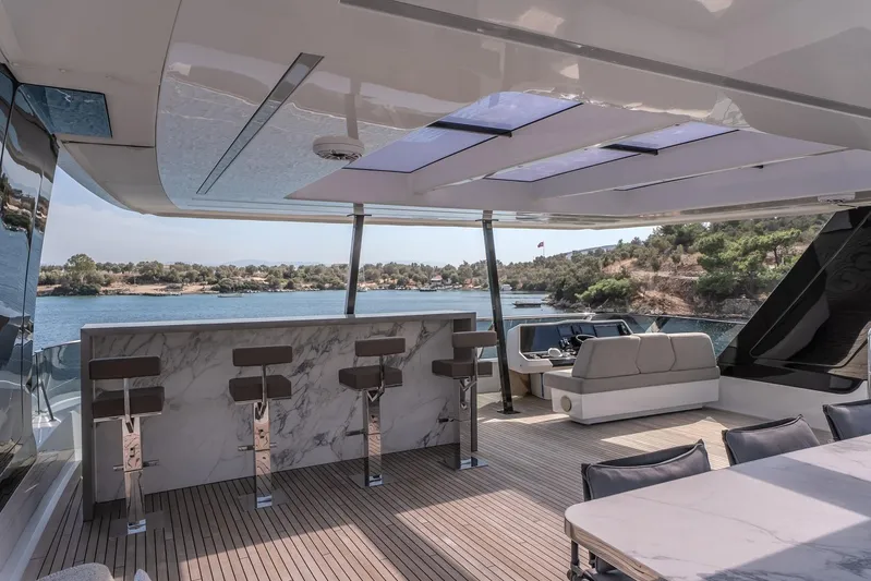  Yacht Photos Pics Luxurious Sunreef 60 Power yacht interior with bar, seating, and scenic ocean view, 2023 model.