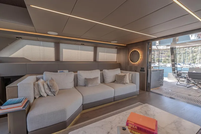  Yacht Photos Pics Luxurious interior of 2023 Sunreef 60 Power yacht with modern furnishings and marina view.