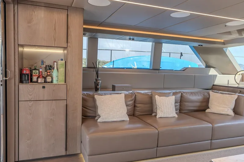  Yacht Photos Pics Luxurious interior of 2023 Sunreef 60 Power yacht with leather seating and a mini bar.