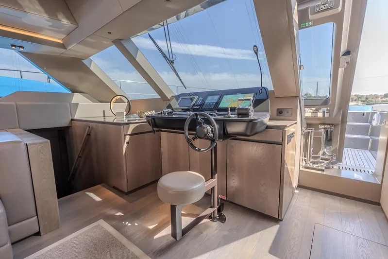  Yacht Photos Pics Luxurious helm station of 2023 Sunreef 60 Power yacht with modern navigation equipment.