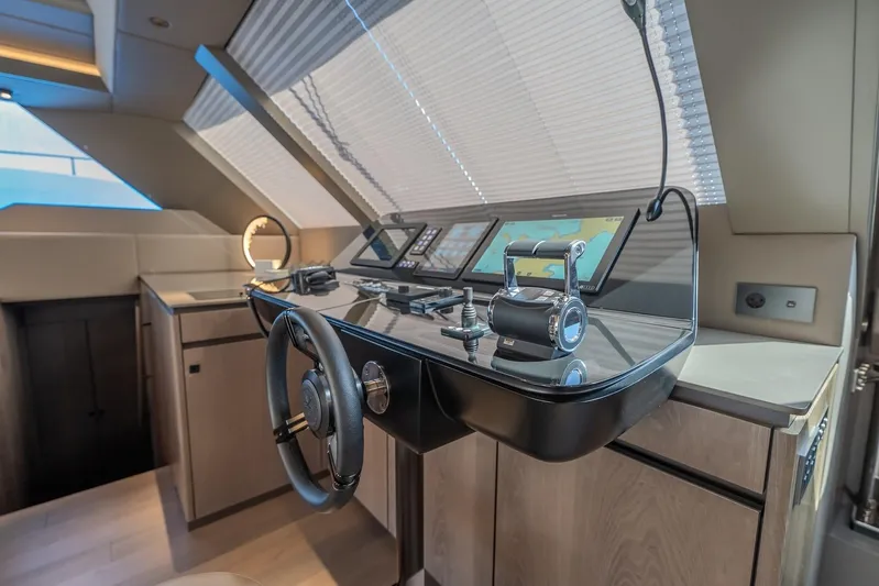 Yacht Photos Pics Luxurious helm station of 2023 Sunreef 60 Power yacht with modern navigation equipment.