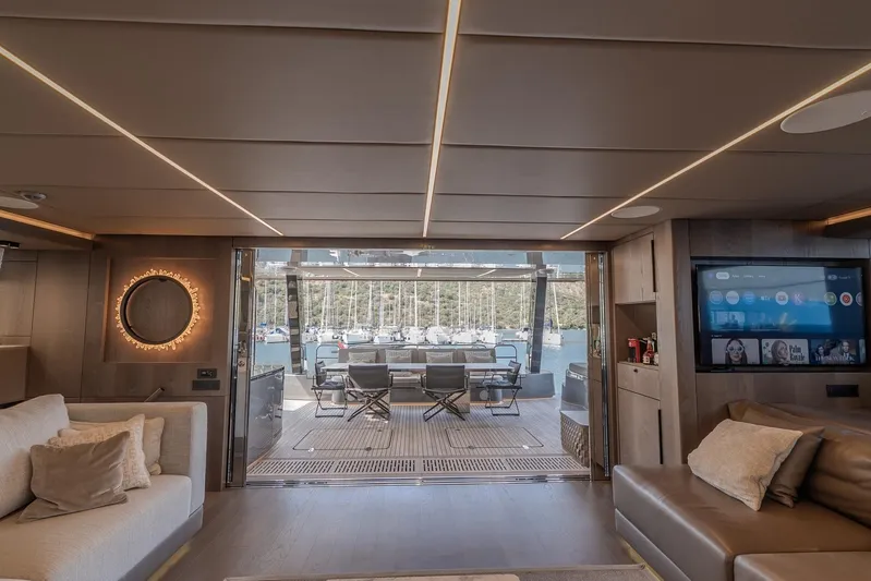  Yacht Photos Pics Luxurious interior of 2023 Sunreef 60 Power yacht with modern decor and marina view.
