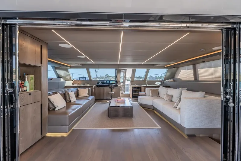  Yacht Photos Pics Luxurious interior of 2023 Sunreef 60 Power yacht with modern furnishings and panoramic windows.
