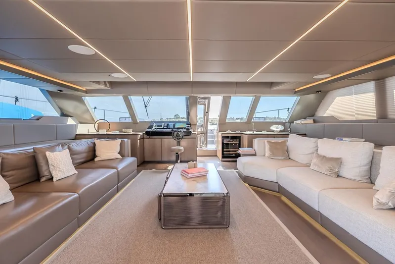  Yacht Photos Pics Luxurious interior of 2023 Sunreef 60 Power yacht with modern seating and panoramic windows.