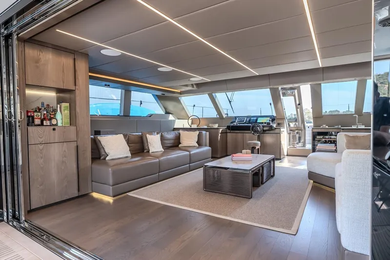  Yacht Photos Pics Luxurious interior of 2023 Sunreef 60 Power yacht with modern furnishings and panoramic windows.