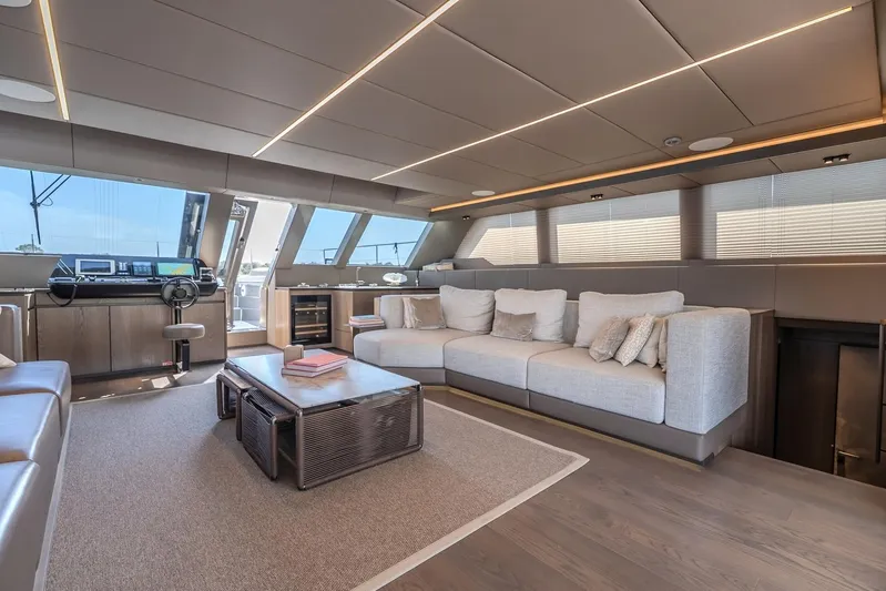  Yacht Photos Pics Luxurious interior of 2023 Sunreef 60 Power yacht with modern seating and navigation area.