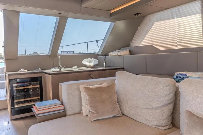  Yacht Photos Pics Luxurious interior of 2023 Sunreef 60 Power yacht with modern furnishings and large windows.