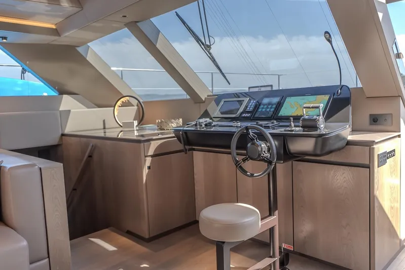  Yacht Photos Pics Luxurious Sunreef 60 Power yacht helm station, 2023 model, featuring modern navigation equipment.