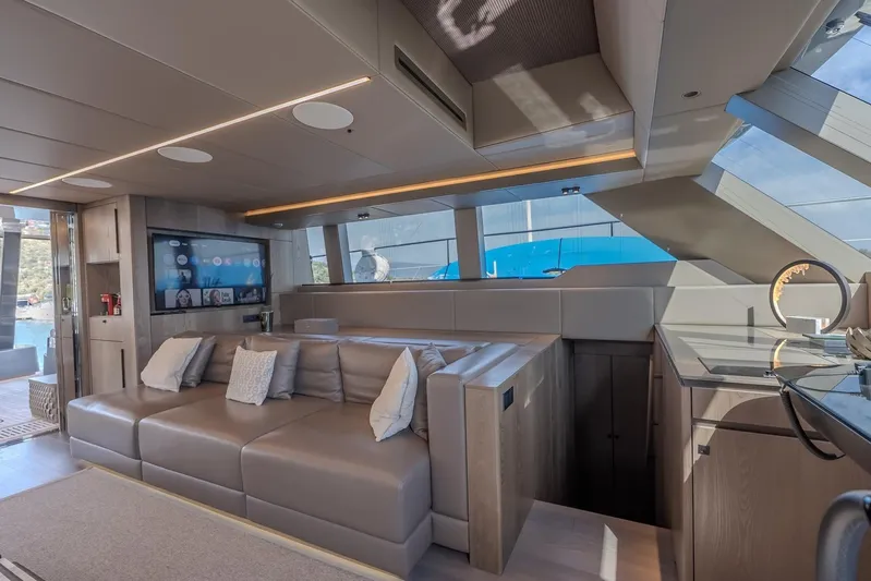  Yacht Photos Pics Luxurious interior of 2023 Sunreef 60 Power yacht with modern seating and entertainment system.