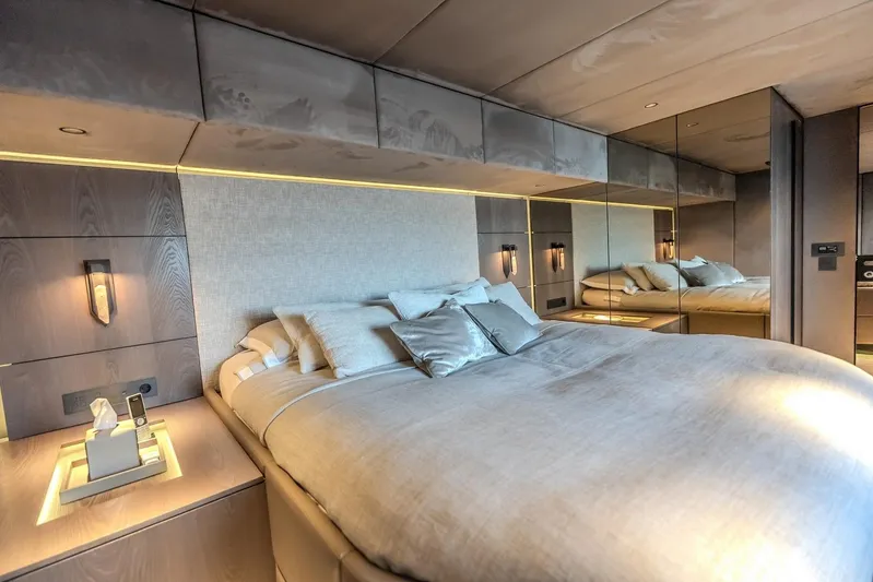 Yacht Photos Pics Luxurious bedroom interior of 2023 Sunreef 60 Power yacht with modern design and ambient lighting.
