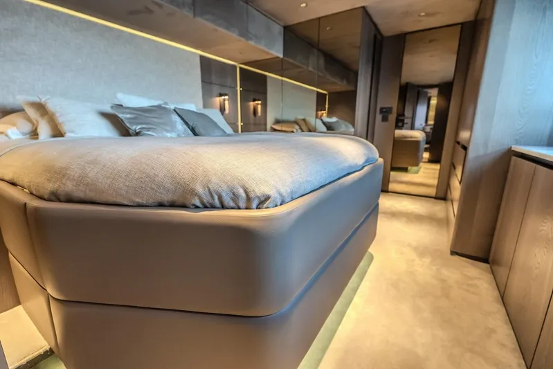  Yacht Photos Pics Luxurious interior of 2023 Sunreef 60 Power yacht, featuring a modern bedroom design.