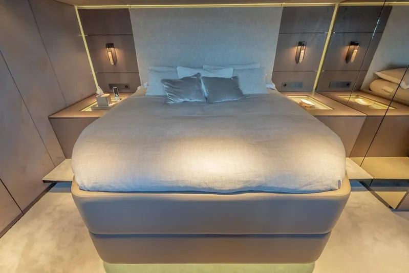  Yacht Photos Pics Luxurious bedroom interior on 2023 Sunreef 60 Power yacht, featuring elegant design and ambient lighting.