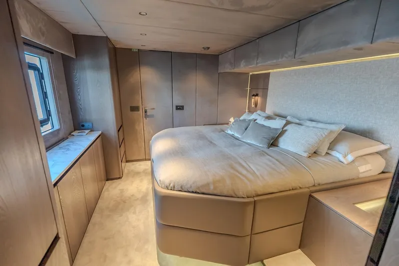  Yacht Photos Pics Luxurious bedroom interior of 2023 Sunreef 60 Power yacht with modern design and cozy bedding.