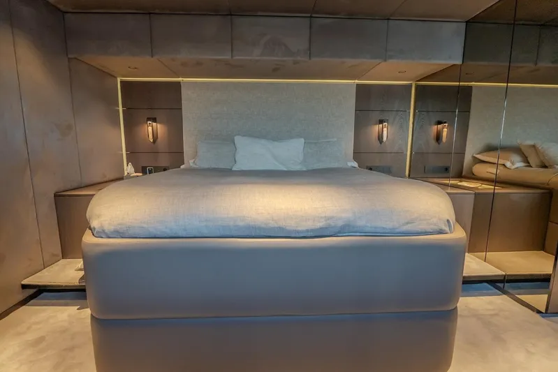  Yacht Photos Pics Luxurious bedroom interior on 2023 Sunreef 60 Power yacht, featuring modern design and ambient lighting.