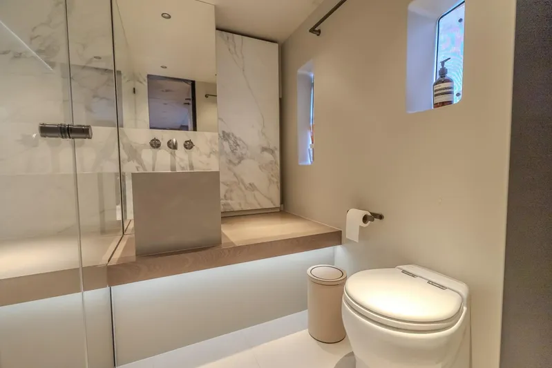  Yacht Photos Pics Luxurious bathroom in 2023 Sunreef 60 Power yacht with modern fixtures and marble accents.