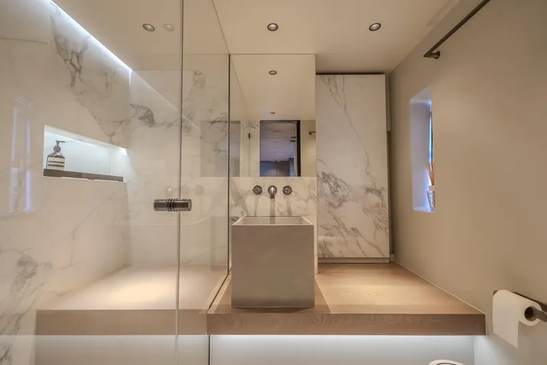 Yacht Photos Pics Luxurious bathroom with marble accents in 2023 Sunreef 60 Power yacht.