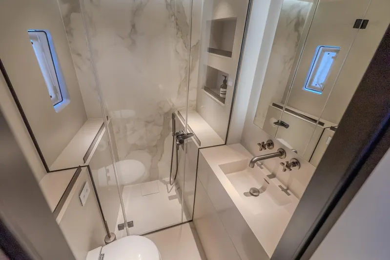  Yacht Photos Pics Luxurious bathroom in 2023 Sunreef 60 Power yacht with modern fixtures and marble accents.