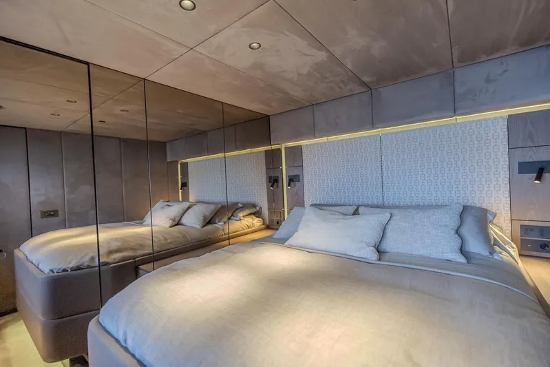  Yacht Photos Pics Luxurious bedroom interior of 2023 Sunreef 60 Power yacht with elegant bedding and mirrored walls.