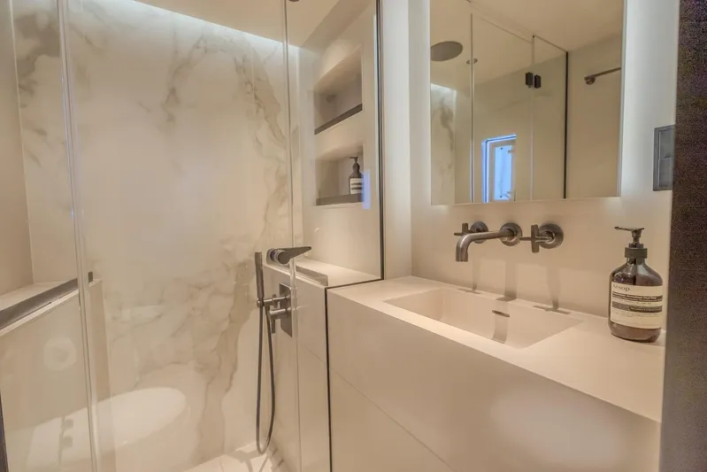  Yacht Photos Pics Luxurious bathroom in 2023 Sunreef 60 Power yacht with modern fixtures and marble accents.