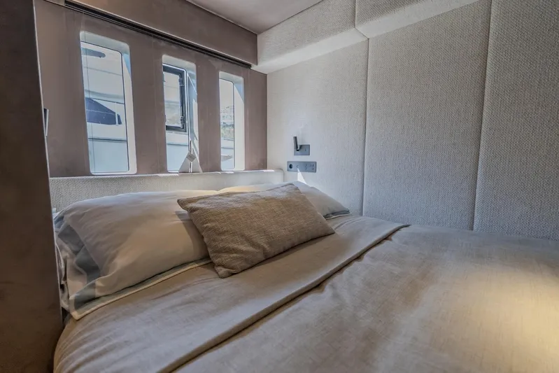  Yacht Photos Pics Luxurious bedroom interior of 2023 Sunreef 60 Power yacht with modern design.