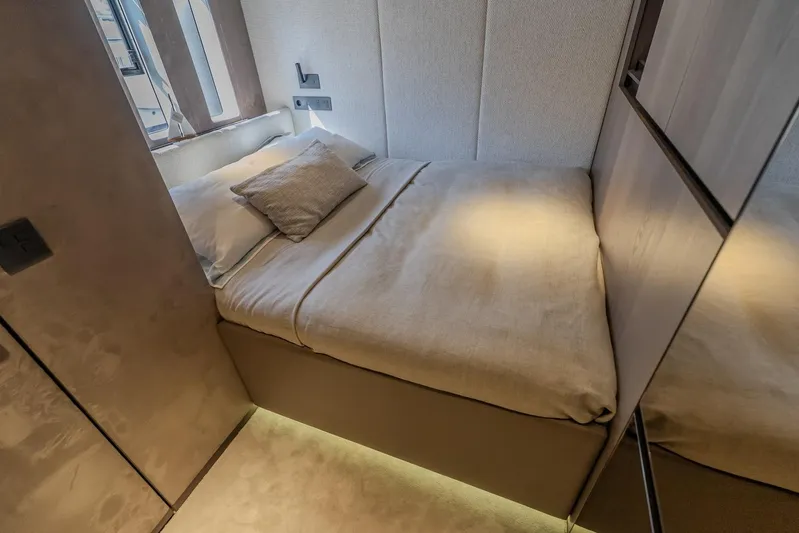  Yacht Photos Pics Luxurious bedroom interior of 2023 Sunreef 60 Power yacht with cozy bedding and modern design.