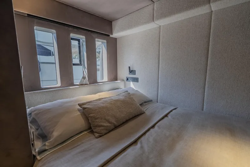  Yacht Photos Pics Luxurious bedroom interior of 2023 Sunreef 60 Power yacht with modern design.