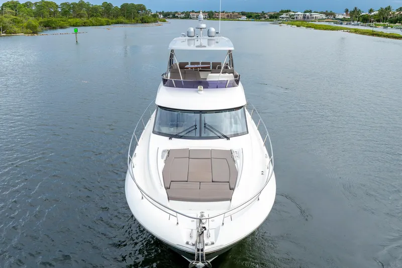 Our Trade Yacht Photos Pics 2017 Prestige 560 yacht cruising on a serene waterway.