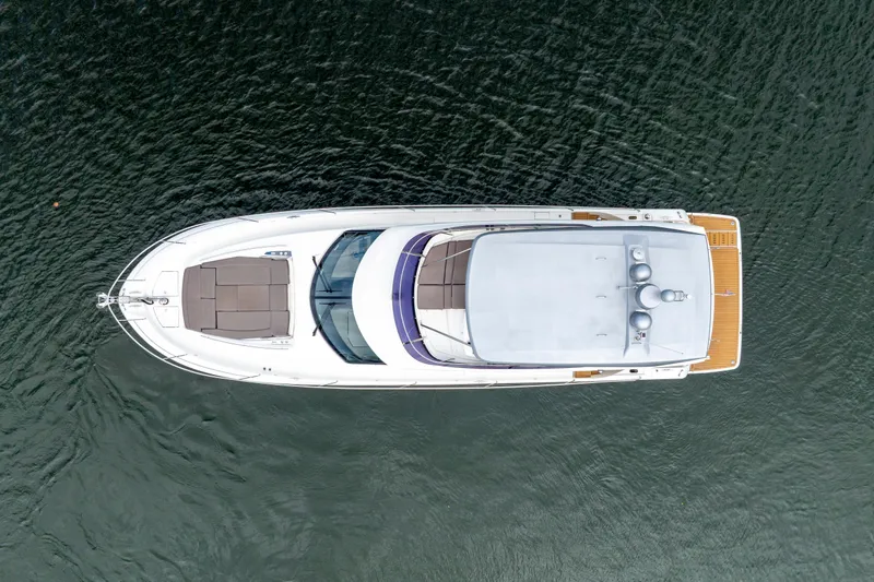 Our Trade Yacht Photos Pics Aerial view of 2017 Prestige 560 yacht on calm water.