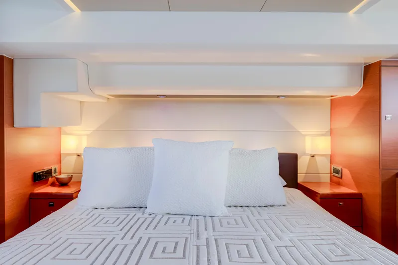 Our Trade Yacht Photos Pics Luxurious bedroom interior of 2017 Prestige 560 yacht with elegant bedding and ambient lighting.