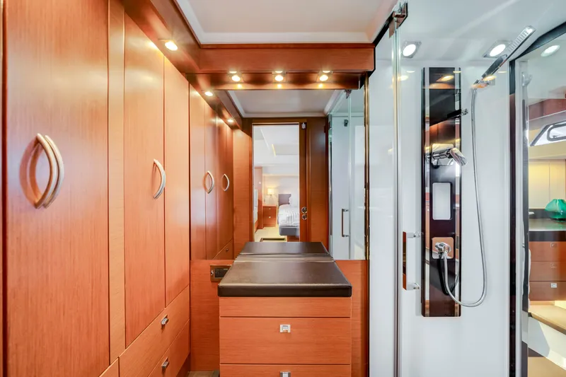 Our Trade Yacht Photos Pics Luxurious interior of 2017 Prestige 560 yacht with wood cabinetry and modern shower.