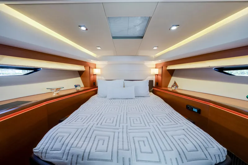 Our Trade Yacht Photos Pics Luxurious bedroom interior of 2017 Prestige 560 yacht with modern lighting and elegant decor.