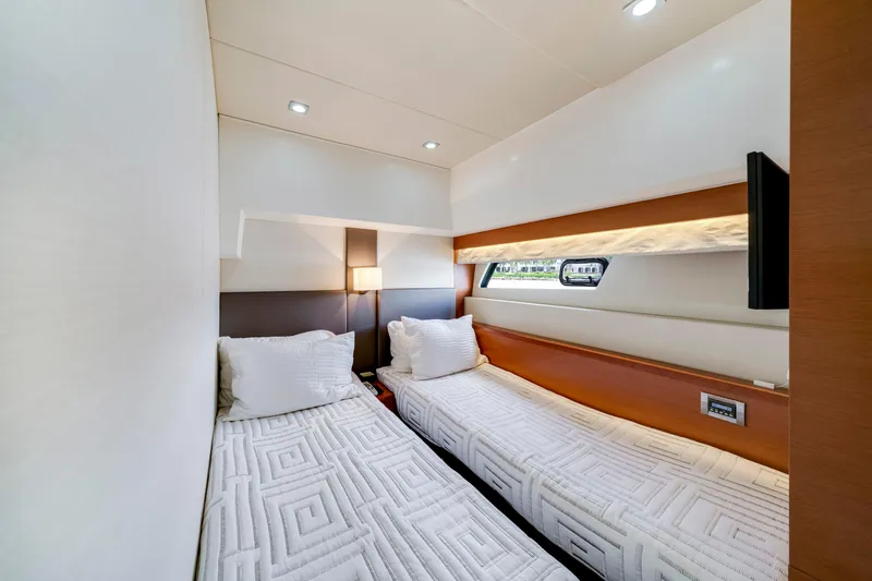 Our Trade Yacht Photos Pics Luxurious twin cabin interior of 2017 Prestige 560 yacht with modern design and ambient lighting.